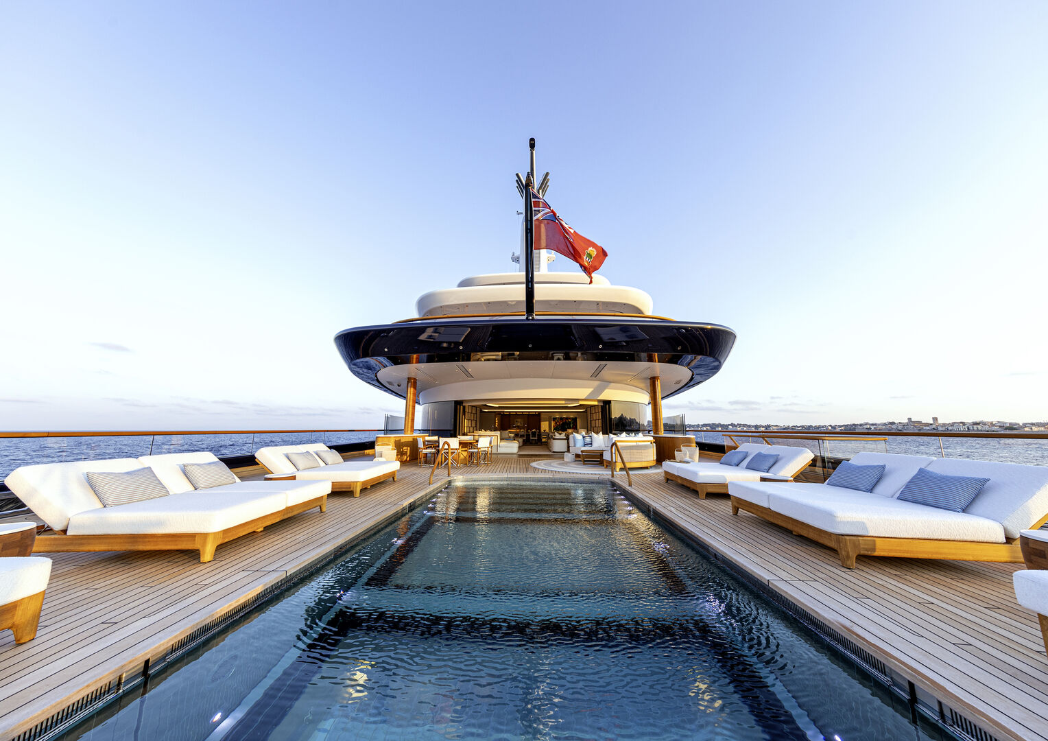 Superyacht deck and pool at sunset